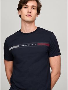 Tommy Hilfiger men's T-shirt. Made from lightweight cotton jersey, known for its breathability and stretch, our comfortable crewneck tee is cut in an easy fit and finished with our Tommy Stripe graphic.  Material: 100% Cotton. Modern Crew Neck T-shirt With Text Print, Graphic Tee With Three Stripes, Crew Neck, Cotton T-shirt With Three Stripes Branding, Crew Neck, Modern Branded Crew Neck T-shirt, Adidas Cotton Crew Neck T-shirt, Tommy Hilfiger Graphic Tee With Crew Neck, Tommy Hilfiger Sporty T-shirt With Graphic Print, Tommy Hilfiger Sporty Graphic Print T-shirt, Tommy Hilfiger Sporty T-shirt For Summer