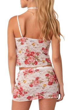 A romantic floral print adorns this sheer lace camisole crafted with a tie at the bust that highlights a delicate keyhole cutout. V-neck Adjustable straps 95% polyester, 5% spandex Hand wash, dry flat Imported Sleeveless Lace Top With Floral Print, Spring Lace Camisole Top, Spring Elegant Lace Patchwork Camisole Top, Lace Patchwork Camisole Tank Top, Fitted Lace Patchwork Camisole For Spring, Lace Floral Print Tops For Daywear, Lace Tops With Floral Print For Daywear, Coquette Lace Camisole, Feminine Lace Camisole With Lace Patchwork