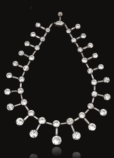 An important Belle Epoque Diamond necklace/tiara, Cartier, circa 1915. Designed as a graduated series of collet-set circular-cut diamonds between baguette stones, suspending a similarly set articulated fringe, to a navette-shaped diamond clasp, signed Cartier Paris Londres, French assay marks and numbered, accompanied by a tiara frame. #Cartier #BelleÉpoque #tiara #necklace King Edward Vii, Edwardian Jewelry, International Jewelry, King Edward, Antique Diamond, Art Deco Jewelry