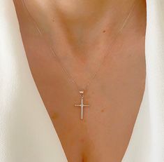 "Real 14K Plain White Gold Cross Necklace. Great Gift To Give Yourself And To Others. Minimal Cross Comes With The Option Of A High Quality Box Chain That Feels Very Silky. A Beautiful Gift She Will Treasure Forever! Jewelry Comes In A Cute Gift Box Ready To Present. Model Is Wearing 16\" Chain. -All Jewelry Is New And Inspected For Quality Assurance. -Jewelry Is Crafted In Genuine High Quality 14K Gold. -We Do Not Sell Gold Plated. Product Detail: Metal: 14k white gold Weight: 0.7 grams Height White Gold Sterling Silver Cross Necklace For Wedding, Classic White Gold Jewelry For Baptism, Elegant Sterling Silver Jewelry For First Communion, Sterling Silver White Gold Necklace For First Communion, Elegant White Gold Necklaces For Baptism, Wedding White Sterling Silver Cross Necklace, Formal White Diamond Cut Cross Necklace, Elegant White Gold Necklace For Baptism, Elegant Silver Cross Necklace For Baptism