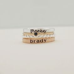 Show off your name and birthstone in style with this stunning Stacking Name Ring Set! Includes 4 stackable rings: a sterling silver beaded ring, a fine silver name ring, a 14K gold-filled birthstone ring, and a 14K gold-filled name ring Perfect personalized gift for mom, wife, daughter, sister or friend Name ring beautifully displays any name or date in elegant lowercase script and modern typewriter font Choose your personalized birthstone to represent your birthday month This one-of-a-kind ring Everyday Adjustable Stackable Birthstone Ring, Adjustable Stacked Sterling Silver Jewelry, Classic Rose Gold Stackable Birthstone Rings, Fine Jewelry Sterling Silver Stackable Engraved Ring, Sterling Silver Stackable Engraved Ring, Silver 14k Gold Engraved Ring With Birthstone, Fine Jewelry Engraved Sterling Silver Stackable Ring, Hand Stamped 14k Gold Jewelry For Promise Ring, Hand Stamped 14k Gold Promise Ring Jewelry