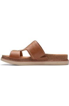 Comfortable Slides With Leather Footbed And Synthetic Material, Slip-on Open Toe Footbed Sandals With Textured Footbed, Slip-on Open Toe Sandals With Textured Footbed, Comfortable Synthetic Mules With Arch Support, Casual Slides With Ortholite Insole, Comfortable Casual Footbed Sandals With Arch Support, Comfortable Slides With Ortholite Insole, Brown Slip-on Footbed Sandals With Arch Support, Casual Slip-on Footbed Sandals With Removable Insole