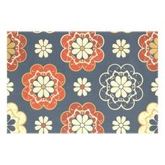 a blue and orange flowered rug with red, white, and yellow flowers on it