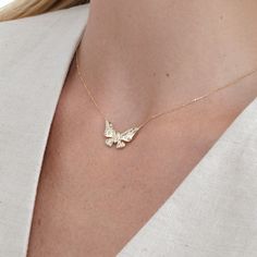 Yara Embrace the delicate beauty of nature with our 14k Gold Diamond Butterfly Necklace. This enchanting minimalist piece features a solid gold butterfly pendant, meticulously crafted to capture the intricate details of its wings. Natural diamonds are flush-set throughout the pendant, creating a subtle yet captivating sparkle that dances with every movement. - Handmade - Solid Gold - Natural Diamonds - G Color, SI Quality Diamonds - The Dimension of the Butterfly: 13.42 mm x 21.80 mm - Total Dia Diamond Butterfly Necklace, Mini Butterfly, Diamond Butterfly, Butterfly Pendant Necklace, April Birthstone, Delicate Beauty, Cute Butterfly, Everyday Necklace, Gold Butterfly