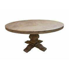 a round wooden table with two crossed legs