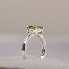 ◆ Hand-finished in Sterling sliver, this piece features a Asscher shaped peridot. Clear zirconia stones decorate half of the ring shank. A piece of classic, it is suitable for engagement, party, daily occasion. ◆ Production Description: Main stone Type: Peridot Main Stone Shape: Asscher Main Stone Size: 7*7mm Side stone: CZ Metal: 925 Sterling silver - Other options available in the drop down menu ◆ Customization: √Free for Add Engraving √Other Metal Type Available √Other Gemstones & Shapes Emerald Cut Peridot Gemstone Jewelry, Anniversary Peridot Diamond Ring, Peridot Diamond Promise Ring, Peridot Diamond Ring With Center Stone For Promise, Peridot Diamond Promise Ring With Center Stone, Anniversary Peridot Jewelry With Diamond Accents, Peridot Birthstone Diamond Ring Fine Jewelry, Sterling Silver Diamond Ring With Asscher Cut Gemstone, Emerald Cut Peridot Birthstone Ring