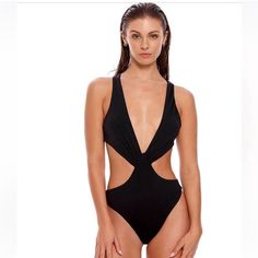 Elevate Your Beach Style With The Agua Bendita Fera One-Piece Swimsuit. This Bold Black One-Piece Features Crisscross Straps, A Trendy Cutout Waist, And An Open Back For A Chic And Flattering Look. The Moderate Coverage Ensures You Feel Confident And Comfortable While Lounging By The Pool Or At The Beach. Made From A High-Quality Blend Of Nylon And Elastane, This Swimsuit Is Both Stylish And Durable. Hand Wash Recommended. Imported. Make A Statement With Agua Bendita, Known For Their Bold Swimwe Cutout One-piece Bodysuit For Beachwear, V-neck Cutout Swimwear For Beachwear, V-neck Cutout Swimwear For Pool, Summer Cutout Bodysuit For Swimming, Cutout Bodysuit For Summer Swimming, Cutout Bodysuit For Swimming Beachwear Style, Sleeveless Cutout Bodysuit For Pool, Elegant Cutout Swimwear For Poolside, Beachwear Triangle Top One Piece With Lined Body