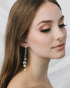 Elegance meets drama in our Kendall Pearl Earrings. These duster earrings are designed with off white pearls dangling from delicate chains of varying lengths. Lightweight for easy day to night wear. Off white, glass pearls Measures 3" in length Hypoallergenic, lead-free & nickel-free Style #4458 Elegant Chandelier Earrings With Adjustable Chain For Party, Classic Pearl White Dangle Pearl Earrings, Pearl Charm Dangle Chandelier Earrings For Party, Pearl Chandelier Drop Earrings With Pearl Chain, Pearl Chain Dangle Chandelier Earrings For Party, Party Pearl Chain Dangle Chandelier Earrings, Pearl Dangle Chandelier Earrings For Evening, White Pearl Chain Linear Earrings For Party, Pearl Chandelier Dangle Earrings For Evening