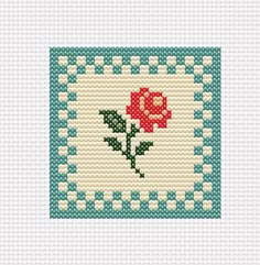 a cross stitch pattern with a red rose on it