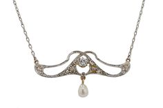 "A beautiful dainty pendant necklace, paying homage to the significant Art Nouveau movement in the early 1900s. A sparkling old European cut diamond sits proudly at its center, while suspended below, a luminous natural freshwater pearl. The platinum openwork is creatively laced above the diamond, creating an asymmetrical and pleasant architecture in this lovely lavaliere. Condition: Very Good Era: Art Nouveau Year: 1910s Metal: Platinum & 18k Yellow Gold Diamonds: Carat Weight: 0.19 Cut: Old European Color: H Clarity: SI2 Accents: 1 Natural Freshwater Pearl 10 Diamonds = 0.08 carats total Pendant Dimensions: 5/8\" H x 1 3/8\" W x 3/16\" D Chain: 18\" x 1mm W Total Weight: 5.6 grams Graded by GIA standards Includes: Certified Appraisal $4,375. Custom box & free expedited shipping. 100% mone Victorian White Gold Pendant Necklace, Antique White Gold Pendant Necklace, Vintage White Gold Necklace With Diamond Accents, Antique White Gold Necklace With Diamond Accents, Antique White Gold Necklace With Pearl Pendant, Antique White Gold Necklace With Single Cut Diamonds, Evening Pendant Necklace With Rose Cut Diamonds, Antique Diamond Accent Pendant Necklace, Antique Evening Necklace With Rose Cut Diamonds