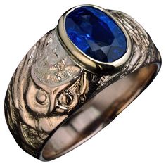 Russia, early 1900s. This antique one-of-a-kind 14K gold ring is designed in the Russian Modern style of the early 1900s. The ring is bezel set with a fine oval sapphire of a royal blue color. The sapphire is flanked by a pair of stylized owls, a popular subject in Art Nouveau era art. The owl symbolizes mystery or secrecy. The black and white image is an architectural relief of an owl on a building in St. Petersburg, circa 1904, around the same time this ring was made. The sapphire measures 9.5 Luxury Oval Sapphire Ring Stamped 14k, Fine Jewelry Oval Sapphire Signet Ring, Oval Sapphire Signet Ring Fine Jewelry, Oval Sapphire Signet Ring In Fine Jewelry Style, Formal 14k Gold Sapphire Ring With Oval Cabochon, Heirloom Style Sapphire Ring With Polished Finish, Oval Sapphire Ring With Polished Finish In 14k Gold, Oval Sapphire Ring In 14k Gold With Polished Finish, Oval Sapphire Signet Ring Hallmarked