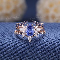 Pear Shaped Cornflower Sapphire Engagement Ring Set 3pcs Art Deco Wedding Rings Women Rose Gold Marquise Diamond Sapphire Wedding Band If you want a men's ring to match this ring, you can take a look at this one. https://www.etsy.com/listing/1535832513/vintage-white-gold-sapphire-mens-rings?click_key= Jewelry Information: ♡ Handmade, high-quality item ♡ Material: SOLID 14K/18K GOLD ( can be made in yellow/white/rose gold ) ♡ Engagement ring ♡ Center stone: Lab grown sapphire  ♡ Size/Weight:  8x6mm  ♡ Cut - Pear Shaped ♡ Color: cornflower blue ♡ Side stones: Moissanite/ Natural diamonds ♡ Weight:  About 0.28ct ♡ Cut - Marquise Shaped ♡ Clarity - SI-VS ♡ Color- G-H ♡ Band Width: Around 1.8mm ♡ Wedding band 1 (top) ♡ Stone: Natural light blue sapphire ♡ Weight: About 0.2ct ♡ Cut - Round Shape Engagement Rings With Blue Sapphire, Wedding Rings Cinderella, Blue Wedding Rings Sets His And Hers, Water Inspired Engagement Ring, Unique Engagement Rings Sapphire Bridal Sets, Engagement Rings For Him And Her, Natural Rings Engagement, Blue Safire Wedding Ring, Wedding Ring Gemstone Unique