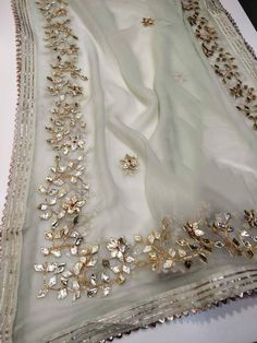 Item Overview ATHARVA Hand Embroidered/Indian Wedding Dupatta Chunni/Light Pista Green Chiffon/Gota Work All over/Tassels/Stole/Wrap/Sarong/Shawl/ ⚘Dno. DUP27 ⚘Hand Embroidered Gota Patti Dupatta/ Stole/ Scarf/Soft Chiffon Chinnon Dupatta ⚘Fabric Customisation: Options Available A. Net B. Organza C. Chiffon Chinnon D. Georgette E. Tabby Silk F. Pure Chiffon (Chamandi) ⚘Length: 2.5 Mtrs ⚘Width: 1.12 Mtrs ⚘Excusive Hand Embroidered Gota Patti Work ⚘Customization: * Fabrics: Designs Can be made in Embroidered Chiffon Dupatta For Eid, Elegant Pista Green Saree With Gota Work, Pista Green Dupatta With Mirror Work, White Silk Dupatta With Mirror Work, Elegant Georgette Dupatta With Gota Work, Chiffon Dupatta With Pallu For Diwali, Pista Green Dupatta With Mirror Work In Traditional Drape, Green Organza Saree With Gota Work, Green Chiffon Saree For Wedding