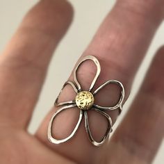 Fantastic handcrafted Sterling silver flower rings that are made to order in your size. They are handmade individually out of Sterling silver wire, oxidized for dimension and polished to high shine. These little pieces of art are relatively flat, mold around your finger and are see through, kind of like lace is. You will love this ring if you like big, handmade jewelry, that is comfortable to wear. These rings don't come from a mold. I make them individually out of wire. They are all very simila Handmade Gold Ring With Flower Shape, Handmade Yellow Gold Flower Ring For Anniversary, Gold Sterling Silver Flower Ring Gift, Gold Sterling Silver Rings With Unique Design, Handmade Nature-inspired Yellow Gold Rings, Handmade Gold Flower Ring, Nature-inspired, Gold Flower Sterling Silver Ring, Handmade Gold Flower Ring Nature-inspired, Unique Handmade Yellow Gold Rings