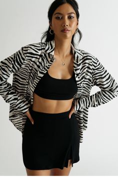 Extra Attention Black & White Zebra Button Down Blouse https://www.tobi.com/product/77997-tobi-extra-attention-zebra-button-down-blouse?color_id=110930&utm_source=pinterest&utm_medium=social&utm_campaign={campaignid}_{adgroupid}_{product_id} Zebra Button Up Outfit, Black Long Sleeve Top With Tiger Print, Black Tiger Print Long Sleeve Tops, Black Long Sleeve Tiger Print Tops, Black Zebra Print Top For Workwear, Casual Long Sleeve Zebra Print Tops, Trendy Long Sleeve Tops With Zebra Print, Trendy Long Sleeve Zebra Print Tops, Trendy Long Sleeve Tiger Print Tops