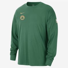 the nike long - sleeved shirt is green and has gold details on the chest