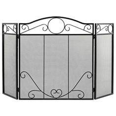 an iron fireplace screen with scroll designs on the top and bottom panels, in black