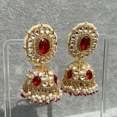 Handmade Style: Traditional Kundan Jhumka Earrings Material: 18k Yellow Gold Plated, Lab Simulated Ruby Stones, Kundan Stones, Pearls Imported Item Number: 7073R Ruby Meenakari Jhumkas For Festivals, Bollywood Style Ruby Chandbali Jhumkas, Traditional Ruby Jhumkas With Tilla, Heavy Ruby Jhumkas For Festive Occasions, Bollywood Style Ruby Jhumkas With Intricate Design, Festive Heavy Ruby Jhumkas, Diwali Ruby Meenakari Jhumkas, Heavy Ruby Traditional Jhumkas, 22k Gold Chandbali Jhumkas For Celebration