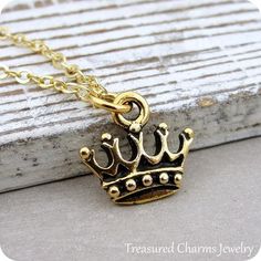 This Royal Crown Charm necklace comes on a gold-plated chain that is available in different lengths. Please choose your desired length from the drop-down menu when placing the item in your shopping cart. { CHARM DETAILS }★ Material: Pewter ★ Finish Color: Gold★ Measurements: 1/2" x 1/2"★ Dimensions: Double-sided★ Made in the USA{ SIMILAR ITEMS } More royal themed items available from my shop: https://www.etsy.com/shop/treasuredcharms/search?search_query=royal{ GIFT OPTIONS}Gift boxes are availab Gold Dangle Charm Necklaces For Birthday, Gold Dangle Charm Necklace For Birthday, Gold Jewelry With Lobster Clasp For Birthday, Gold Charm Necklaces With Adjustable Chain For Birthday, Gold Charm Necklace With Adjustable Chain For Birthday, Spiritual Gold Charm Necklaces For Birthday Gift, Gold Dangle Necklace For Birthday, Spiritual Gold Charm Necklace For Birthday Gift, Gold Metal Necklaces For Birthday