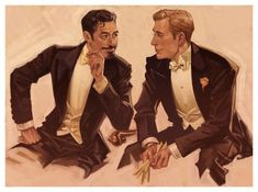 two men in tuxedos sitting next to each other