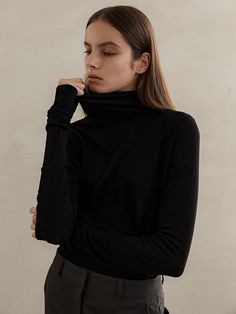 Composition : tencel70% wool30%Color : blackCountry of Origin : Republic of Korea Classic Black High Neck Top, Black High Neck Turtleneck For Work, Classic High Neck Black Top, Black High Neck Classic Top, Black Stretch Turtleneck In Fine Knit, Black Stretch Fine Knit Turtleneck, Black Stretch Turtleneck With Fine Knit, Sleek Black Long Sleeve Turtleneck, Classic Black Funnel Neck Top