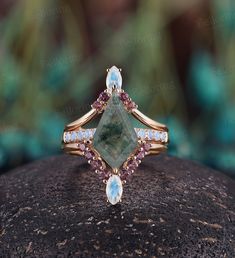 a close up of a ring on top of a rock