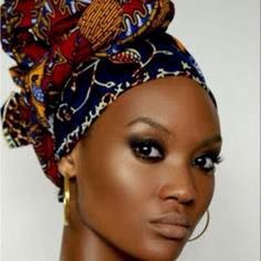 an african woman wearing a head scarf