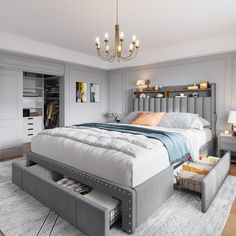 a bedroom with a bed, dressers and drawers on the floor in front of a chandelier