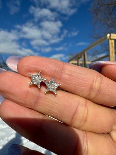 ✥ These stunning 14K white gold star moissanite diamond stud earrings make a wonderful Christmas present that will liven up the festivities. These earrings, which have bright star-shaped moissanite stones set in them, have the same breathtaking brilliance as diamonds but with a special twist. They are a sophisticated addition for any event because of the 14K white gold setting, which amplifies the sparkle. These stunning star-shaped earrings are a unique and opulent gift that will provide festiv Lozenge Cut, Gold Star Earrings, Earrings Classic, Everyday Elegance, Celebrating Christmas, Star Design, Stud Earrings For Women, Diamond Stud Earrings, Gold Star