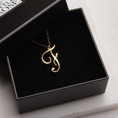 "F Initial Necklace - Cursive \"F\" initial gold pendant - Personalized initial gold pendant for women / Gift for her / for mom / for wife / Dainty \"F\" initial. Perfect every day necklace. Lovely gift for your self, sister, bridesmaids, new mom. Convo me if you would like to customize the length of the chain. The possibilities are endless. Pendant: Base metal is brass and 16K gold plated.  Chain is 18 inches, 14k gold filled. (if you would like a longer or shorter chain, please contact us to c Elegant Initial Pendant Necklace For Anniversary, Yellow Gold Initial Pendant Necklace For Mom, Gold Initial Necklace For Mother's Day, Elegant Pendant Initial Necklace For Anniversary, Elegant Tan Necklaces For Gifts, Elegant Tan Necklace For Gift, Elegant Tan Jewelry For Gift, Anniversary Gift Initial Pendant Necklace, Gold Initials Name Necklace For Mom