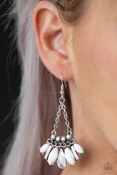 A collision of white marquise beads, sleek silver triangular frames, and a faceted silver teardrop coalesce at the bottom of a studded and chain-link frame for a wild tribal inspired look. Earring attaches to a standard fishhook fitting. Sold as one pair of earrings. P5TR-WTXX-065XX SUMMER PACK EXCLUSIVE 2019 Fish Hook Earrings, Paparazzi Accessories, Paparazzi Jewelry, White Earrings, Metal Pendant, Silver Earrings Dangle, White Beads, Jewelry Party, Boho Jewelry