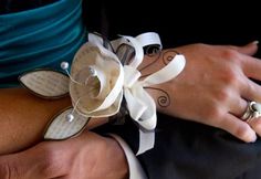 a close up of two people wearing wedding rings and holding each other's hands