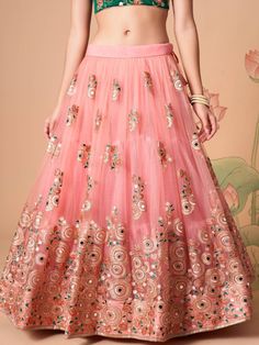 Become the subject of everyone’s conversation by outfitting in this delightful peach color lehenga made with net material designed with mirror work, thread embroidery, and sequin work. This peach lehenga comes with a green color art silk material choli made with embroidery and mirror work. It also comes with a peach color net material dupatta made with thread embroidery and sequin work. This peach lehenga is stitched and can be customized up to 42 inches. The choli will be fully stitched materia Festive Anarkali Embellished Skirt, Traditional Skirt With Mirror Work For Reception, Semi-stitched Skirt With Resham Embroidery For Reception, Reception Skirt With Resham Embroidery, Semi-stitched, Traditional Embellished Skirt For Wedding, Traditional Embellished Wedding Skirt, Anarkali Skirt With Resham Embroidery For Navratri, Anarkali Skirt With Mirror Work For Reception, Embroidered Skirt For Wedding And Navratri