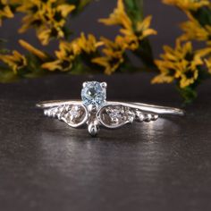 "Womens blue topaz silver ring, Unique small & dainty art deco topaz promise ring for her, Delicate filigree silver promise ring WE OFFER UNLIMITED PERIOD INSTALLMENTS PLAN This is a beautiful, stunning, feminine ring that works well for all occasions, styles, and ages. You will love it! Ring information Main stone: Sky topaz Approximate size: 3.0mm Accent stones: White cubic zirconia Approximate size: 1.5mm (2 stones) Approximate size: 1.25mm (2 stones) Metal type: Silver Metal stamp: 925 S Elegant Light Blue Sapphire Promise Ring, Light Blue Diamond Promise Ring, Elegant Light Blue Crystal Promise Ring, Elegant Light Blue Birthstone Promise Ring, Elegant Light Blue Promise Ring, Elegant Sterling Silver Birthstone Ring With Rose Cut Diamonds, Dainty Diamond Ring With Accent Stones For Promise, Elegant Topaz Ring With Rose Cut Diamonds For Promise, Elegant Light Blue Rings With Prong Setting