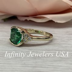 "The ring pictured is lab created emerald and moissanite #6902 Rose Gold is available upon request as a custom order and is a final sale (non refunable, non returnable, non exchangeable). Emerald is the Birthstone for May -Approximate total carat weight: 2.52ctw. diamond equivalent -Center Stone Size: approx. 2.40ct. diamond equivalent -Gem Type: Lab created emerald -Center Stone Shape: cushion cut 8x8mm -Center Stone Color: green, nicest color in emeralds -Center Stone Clarity: VS2 or better -M Green Diamond Ring With Bezel Setting, Green Diamond Ring With Bezel Setting, Round Cut, Green Bezel Set Birthstone Ring For Anniversary, Green Diamond Ring With Bezel Setting In Round Cut, Moissanite Emerald Ring With Center Stone For Anniversary, Heirloom Green Diamond Ring With Bezel Setting, Anniversary Moissanite Emerald Ring With Center Stone, Green Birthstone Ring With Bezel Setting For Anniversary, Anniversary Green Birthstone Ring With Bezel Setting