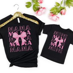 Get ready to elevate your mommy-and-me style with these adorable matching jersey short sleeve tees! 🌸 Made from 100% Airlume combed and ringspun cotton, these tees offer ultimate comfort for both mom and daughter. It's like wearing a warm hug from each other all day long! ✨ The quality print on each tee adds a touch of charm to your twinning attire. With ribbed knit collars, these tees offer a perfect fit for both of you while maintaining their shape over countless washes and wears. 👚 Crafted Cute Family T-shirt With Letter Print, Pink Short Sleeve T-shirt For Family, Mother's Day Family T-shirt With Funny Print, Funny Print Short Sleeve Shirt For Mother's Day, Black Family Matching Shirt For Mother's Day, Short Sleeve T-shirt With Text Print, Matching Cotton T-shirt For Mother's Day, Cute Short Sleeve Tops For Mother's Day, Matching Short Sleeve T-shirt For Birthday