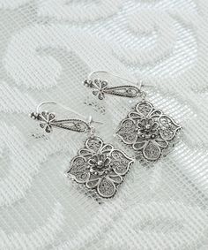 Handmade Silver Filigree Art Floral Dangle Earrings, 925 Sterling Silver Daisy Flower Women Drop Earrings, Vintage Delicate Ornate Earrings Silver gift for mom, best gift for her Earrings' Length : 4.2 ( 1.65 in )   Width : 2cm ( 0.8 in ) These handmade silver filigree Art Floral Dangle Earrings, 925 Sterling Silver Daisy Flower Women Drop Earrings are a stunning piece of jewelry for the contemporary woman. These delicate and elegant vintage floral earrings are sure to make a great addition to a Classic Filigree Chandelier Earrings For Gift, Classic Filigree Chandelier Earrings As Gift, Silver Drop Flower Earrings Gift, Silver Filigree Chandelier Earrings For Anniversary, Silver Bohemian Flower-shaped Earrings, Bohemian Silver Flower-shaped Earrings, Bohemian Silver Flower Shaped Earrings, Silver Pierced Flower Earrings For Gift, Ornate Sterling Silver Chandelier Earrings As Gift