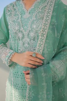 Long Mint Green Kameez With Trouser Pakistani Dress comes in an Embroidered Sleeves, Embroidered Sleeves Border, Lace Neckline, Lace Patches for Slits, and Lace Borders. It is paired with Embroidered Net Dupatta, Embroidered Dupatta Length Border, and Embroidered Dupatta Border, it has Plain Dyed Back, paired with same color plain trousers. Detailed Description: SKU: PB0024 Detailing: Embroidery, Threads, Floral designs Color: Mint Green Fabric: Lawn Design: Fully Embroidered dress Event: Festiv Green Kameez, Mint Green Fabric, Dupatta Border, Dress Event, Lawn Design, Color Plain, Border Lace, Pakistan Fashion, Eid Dresses