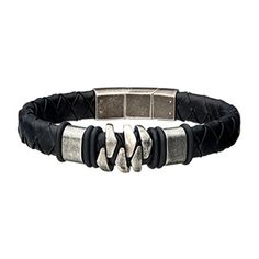 The Men's Stainless Steel and Gun Metal Black Leather Bohemian Bracelet from INOX features a black braided leather band with a metallic clasp. The centerpiece boasts three interlocking silver segments flanked by black rubber rings, exuding a rugged and masculine design. Adjustable Metal Bracelet With Leather Strap, Adjustable Metal Bracelets With Leather Strap, Adjustable Gunmetal Bracelets With Stainless Steel Clasp, Adjustable Black Braided Bracelet With Stainless Steel Clasp, Masculine Black Band Adjustable Bracelet, Masculine Black Adjustable Bracelets, Masculine Adjustable Black Bracelets, Adjustable Gunmetal Bracelet, Masculine Adjustable Black Band Bracelets