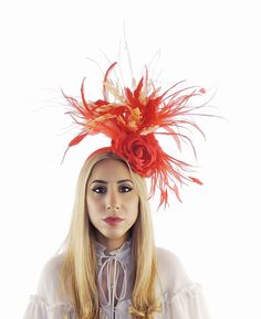 Hats By Cressida Kentucky Derby & Ascot Fascinator Hats Spring Summer Hat & Fascinator Collection A mass of of red & peach feathers surround a red rose Main body about 6-7 inches wide, bigger with the long wispy feathers Mounted with a matching headband. If you prefer a headband to match your hair, please make a note at check out what colour headband you want. This fascinator is perfect for any formal occasion such as a wedding, bridal shower, tea party or ladies luncheon.  This headpiece also is great for a day at the races like the Kentucky Derby, Ladies Day, Royal Ascot, Cheltenham, Goodwood, DUbai Cup, Breeders Bup and SPring Racing Festival.  We make each hat to order just for you, we would prefer if you did not order for choice. If colour match is important to you please ask for free Red Feathered Fascinator For Kentucky Derby, Red Feathered Hat For Races, Red Carnival Party Costume Hats And Headpieces, Red Carnival Costume Hats And Headpieces For Party, Carnival Mini Hat Headband For Races, Red Feathered Costume Hat For Races, Elegant Hair Accessories For Carnival, Carnival Races Mini Hat Headband, Adjustable Orange Mini Hats For Party