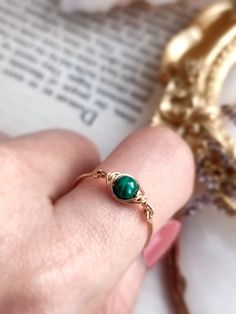 💚 Dainty Malachite Wire Wrapped Eye Ring, Midi Ring in 14K Gold Filled, Rose Gold Filled, Sterling Silver Gemstone Ring ✨ Simple & cute eye ring in a simple wire-wrapping design. A perfect gift and an affordable treat for yourself.  * Gemstone Size: 4mm ✨Malachite gemstone meaning ✨ * Malachite is known as a stone of transformation. It opens the heart to harmony. Helps reveal and heal emotional pain. It has been used to bring ease during transitional times and personal growth. * This ring is ha Handmade 14k Gold Rings For May Birthstone, Adjustable Rose Gold Ring For May Birthstone, Hand Wrapped Green Ring For Gift, Malachite Rings As Gifts, Malachite Rings Suitable For Gifts, Malachite Rings Gift, Green Wire Wrapped Rings, Yellow Gold Malachite Ring Gift, Green Wire Wrapped Promise Ring