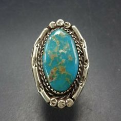 "VINTAGE TURQUOISE RING DESCRIPTION: This ring will be a treasured addition to your collection of fine vintage Southwestern and Native American jewelry. MEASUREMENTS: Ring face measures 1 3/8\" x 7/8\" Cabochon measures 24mm x 13mm RING SIZE: 6 1/4 WEIGHT: 8.2 grams SIGNED: no STERLING: unmarked, verified sterling silver" Vintage Etched Engraved Ring, Collectible Western Style Turquoise Ring Stamped 925, Southwestern Style Stamped Turquoise Ring As Gift, Southwestern Stamped Turquoise Ring, Southwestern Stamped Turquoise Ring Gift, Antique Etched Rings For Collectors, Vintage Sterling Silver Turquoise Ring Stamped 925, Southwestern Engraved Rings For Anniversary, Vintage Handmade Oval Engraved Ring