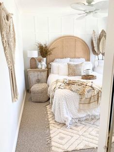 a bedroom with white walls and neutral decor