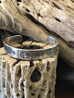 A sterling silver cuff bracelet. Hammered and Stamped. Handmade. Made right here in my little ole shop in Texas. Heavy gauge sterling. 14 gauge. Made to hold up to a lifetime of use.  <Length-7 1/4". <Gap-1 1/2". <Width-1/2". Many of the stamps I use in my shop are made by Native American Navajo artists.  Some old,vintage. Some new. Southwestern Blue Cuff Bracelet Stamped 925, Turquoise Western Stamped Cuff Bracelet, Vintage Turquoise Stamped Cuff Bracelet, Hand-tooled Southwestern Cuff Bracelet As Gift, Southwestern Silver Hand-strung Bracelets, Sterling Silver Cuff Bracelet, Sterling Silver Cuff, Old Vintage, Silver Cuff Bracelet