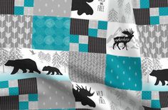 an image of a bear and moose pattern on a blue, gray and white background