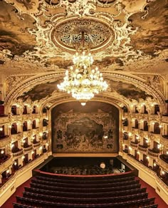 an ornately decorated auditorium with chandelier