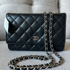 Chanel Wallet On Chain Black Lambskin With Silver Toned Hardware. A33814 Y01480 C3906 Purchased In 2014 At Neiman Marcus Miami, Fl. Used 2-3 Times. Tag Still On The Bag. Excellent Condition. Has Been Stored For Years. Not Corner Wear, No Odor, Inside Perfect, Chanel Cc On Front Flap Has No Scratches. Back Pocket. Interior Zipper Compartment And Card Slots. Burgundy Interior. Comes With Dust Bag, Box, And Authenticity Card. Shoulder Strap Drop: 25.25” Height: 4.75” Depth: 0.75” Width: 7.5 Classic Timeless Piece. As Is Typical With The Velvety Soft Lambskin, There May Be Slight Scuffing. I Tried To Find Any Scuff Marks And The Only Thing I See Is Very Small Slight Superficial Scuffing Burgundy Interior, Chanel Wallet On Chain, Wallet On Chain, Chanel Wallet, Miami Fl, Beautiful Bags, Timeless Classic, Chanel Bag, Timeless Pieces