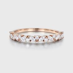 Discover elegance in every sparkle with our Rose Gold Moissanite Wedding Band for Women in a half eternity design. It's a symbol of love and sophistication. Marquise Lab Grown Diamond Wedding Ring, Wedding Eternity Band With Lab Grown Diamonds, Wedding Ring With Half Eternity Lab Grown Diamonds, Moissanite Half Eternity Band For Wedding, Elegant Halo Eternity Band For Wedding, Moissanite Half Eternity Wedding Band, Wedding Moissanite Half Eternity Band, Lab Grown Diamond Half Eternity Wedding Ring, Wedding Half Eternity Moissanite Band