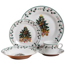 christmas tree dinnerware set with matching saucer and cup, decorated with holly berries