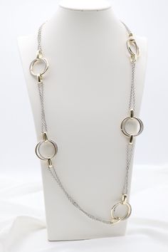 This Gold & Silver Cable Floating Dig Circle Double Belcher Necklace is expertly crafted and designed to elevate any look. Made from high-quality gold and silver, this necklace features a unique floating dig circle design and a double belcher chain for a modern and luxurious touch. A must-have for any jewelry collection. Length: 36 inches Circle: 1.13” Width Closure: Lobster Claw Material: Brass with 18K Gold Plating and Rhodium Coating Lead Free and Hypoallergenic Silver Circle Necklace For Formal Occasions, Formal Silver Circle Necklace, Elegant Silver Open Circle Necklace, Elegant Open Circle Silver Necklace, Silver Double Chain Round Pendant Jewelry, Modern Gold Open Circle Necklace, Modern Metal Jewelry With Double Chain, White Gold Double Chain Metal Jewelry, Silver Long Necklace With Adjustable Chain